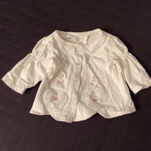 White 4 button cotton jacket with hearts & roses. Size 3/6 months.